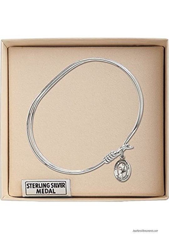 7 inch Oval Eye Hook Bangle Bracelet with a St. Bernadette charm.